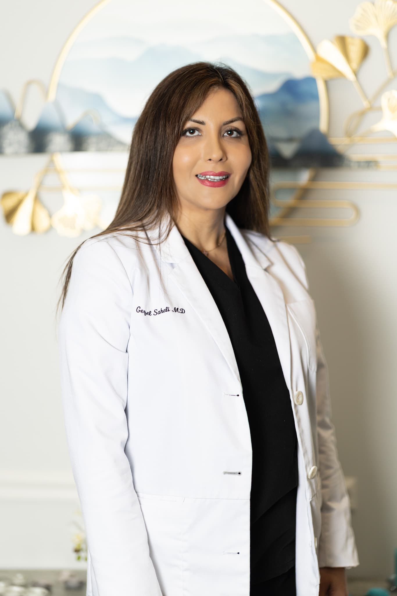 Portrait of Gezel Saheli, MD, in her physician’s coat