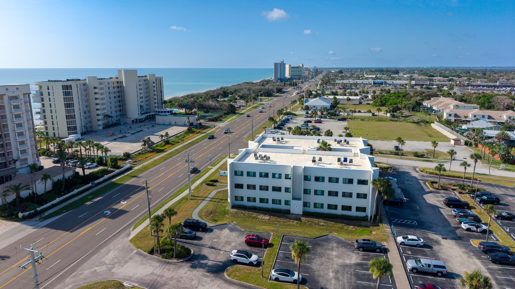 Aerial view of Atlantis Wellness Centers near the coast in Indian Harbour Beach, Florida